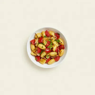 Salade tiède de gnocchis aux tomates confites