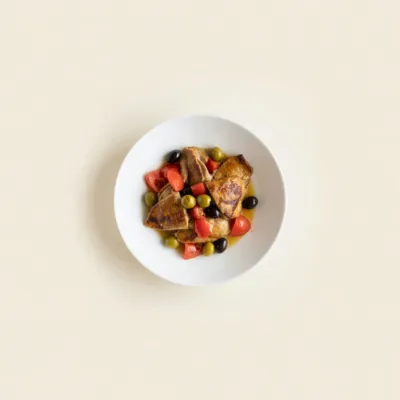 Sauté de lapin aux olives et tomates